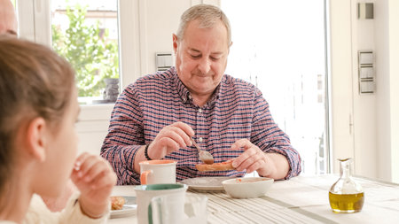 Non-normative family having breakfast togetherの写真素材