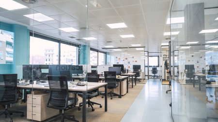 Interior of creative coworking workspace with computer desksの写真素材