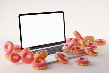 3d rendering of laptop mock up with donuts placed on white backgroundの写真素材