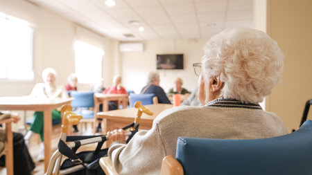 Elderly woman with foldable walker in nursing homeの写真素材