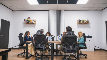 Group of creative businesspeople discussing at conference table in officeの写真素材