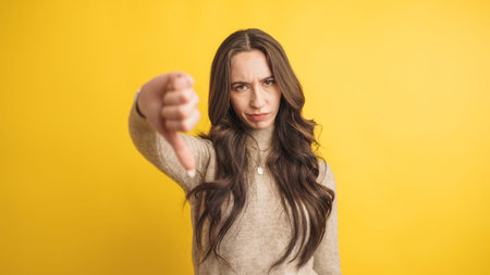 Woman expressing disapproval with thumbs down gesture