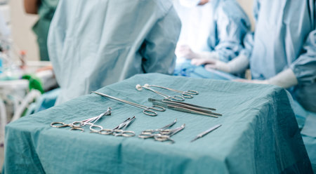 A surgeon organizing medical tools and preparing for surgery in a hospital operating room.の写真素材