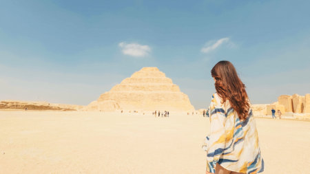 Tourist walking towards the step pyramid of djoser in saqqara, egyptの写真素材