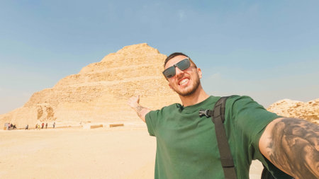 Tourist showing the step pyramid of djoser in saqqara, egyptの写真素材