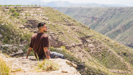 Tourist admiring the landscape of gorafe megalithic park in spainの写真素材