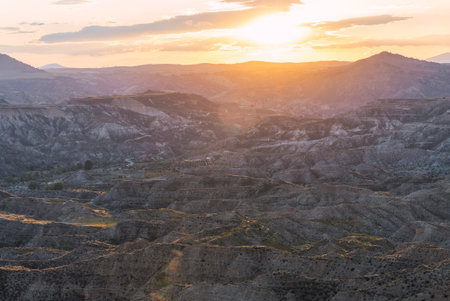 Golden sunset illuminating the desert landscape of gorafe, spainの写真素材