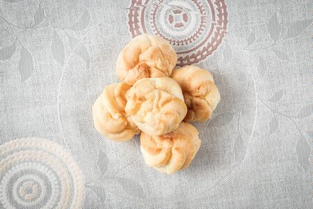 a plate of choux cream on the tableの写真素材