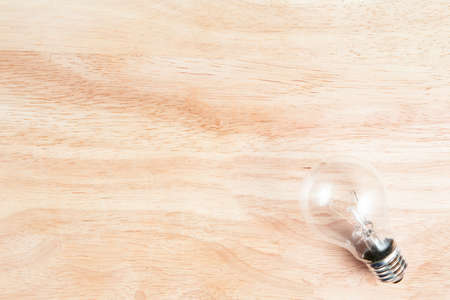 light bulb on the wood backgroundの写真素材