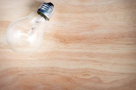 light bulb on the wood backgroundの写真素材