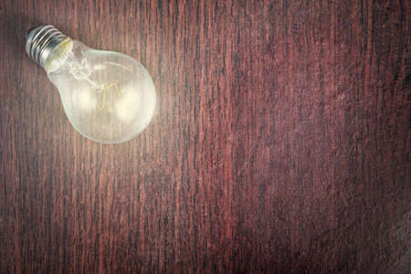 light bulb on the wood backgroundの写真素材