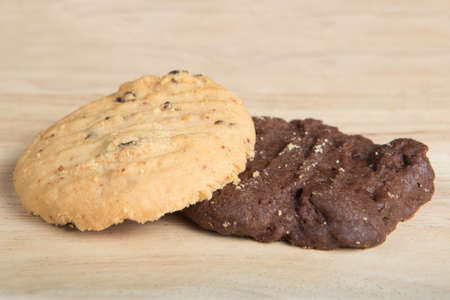 two cookies arrange on the wood blockの写真素材