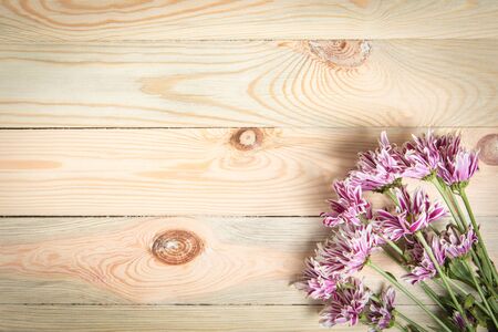 Pink flower on wooden background with blank space for text.Selective focus.の写真素材