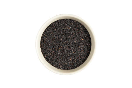 isolated bowl of black sesame on a white backgroundの写真素材