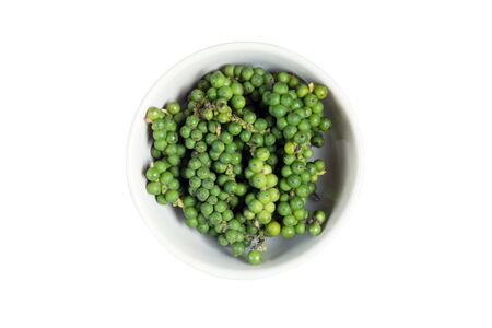 isolated bowl of fresh green pepper on a white backgroundの写真素材