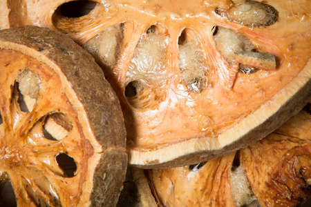 close up dried bael fruit as a backgroundの写真素材