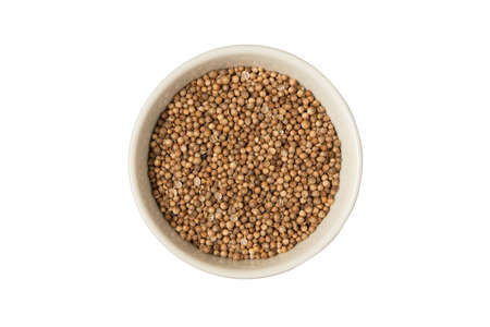 Isolated bowl of dried coriander seed on a white backgroundの写真素材