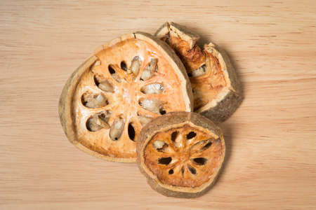pile of dried beal fruit on a wood backgroundの写真素材