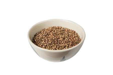 Isolated bowl of dried coriander seed on a white backgroundの写真素材