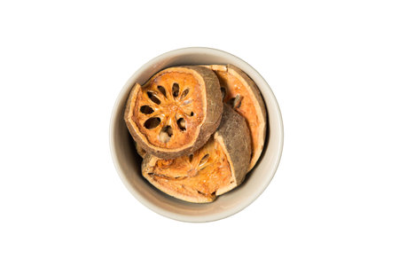 Isolated  bowl of dried beal fruit on a white background