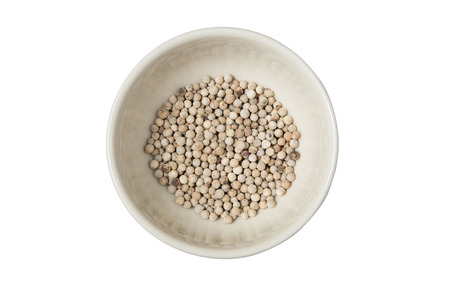 Isolated bowl of white dried pepper on a white backgroundの写真素材