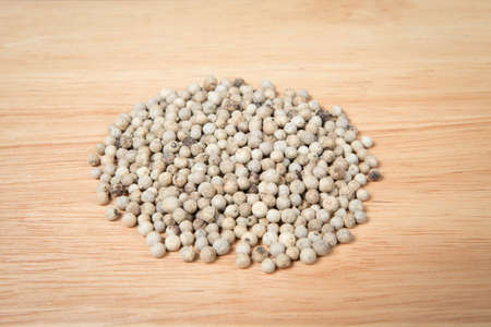 pile of white dried pepper on a wood backgroundの写真素材