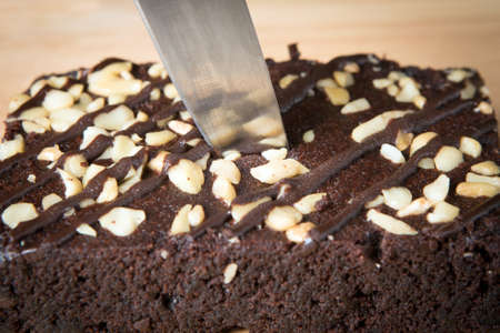 knife pin on a chocolate  browniesの写真素材