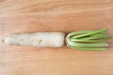 radish vegetable on a wooden backgroundの写真素材