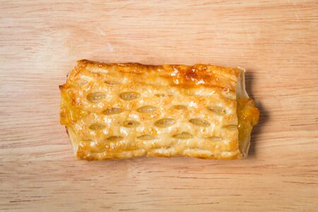sweet corn pie on a wooden block の写真素材