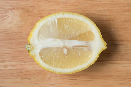 sliced lemon fruit on a wooden block