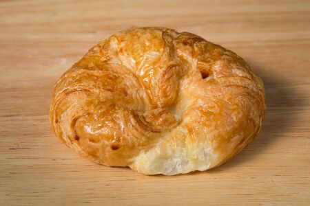 butter croissant   on a wooden blockの写真素材