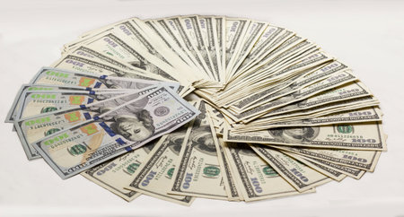 New and old type hundred dollars banknotes fanned out on gray background isolated