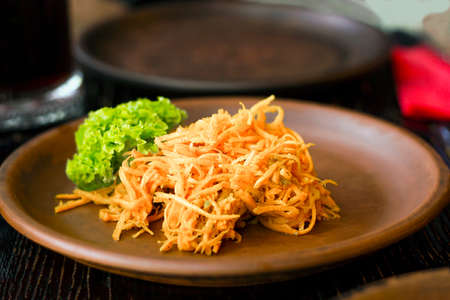 Korean carrot with green leaf lettuce on clay plate, selective focusの写真素材