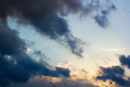 Thunderclouds with clouds on blue sky after rain