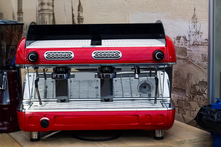 Red coffee machine. Coffee maker machine on table