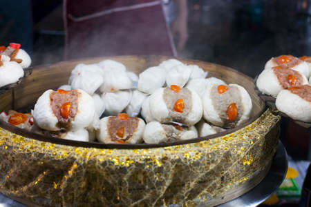 Thai white steamed buns salapao at street marketの写真素材