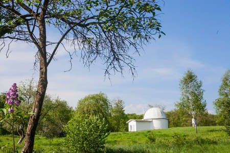 Old Astronomical Observatory of Lviv University in Ukraine. Summer landscape with white astronomy buildingの写真素材