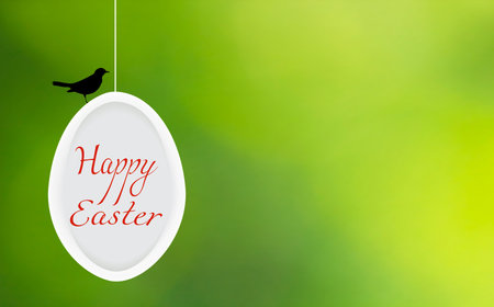 Happy Easter greeting card. Spring festive wallpaper on green blurry background. Decorative white...