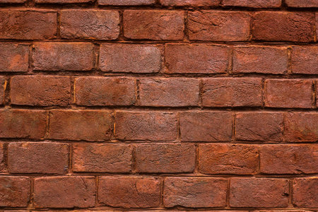 Brick wall dirty grunge texture. Background of red solid distressed brickwall on old vintage bulding...