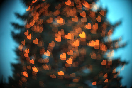 Blur background with glowing heart bokeh. Defocus abstract romantic shine wallpaper. Valentine day...