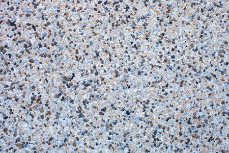 Abstract background decorative mosaic plaster. Stucco backdrop with rocks crumbs. Pebble plaster...
