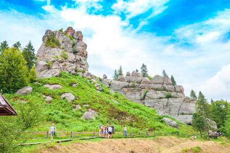 Skole, Lviv region, Ukraine - 25 July 2020: Old ruins fortress of Tustan. Cliff-side defensive complex and group of touristsのeditorial素材