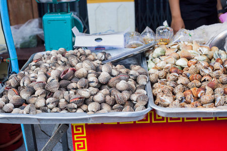 Street food seashells on street market in Phuket, Thailand