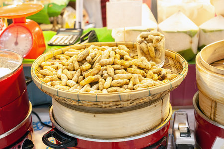 Peanuts heap. Unpeeled nuts sale in super marketの写真素材