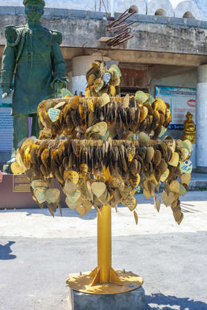 Phuket, Thailand - 28 February 2018: Artificial tree with hanging metal heart shaped leaves with messages written on it by visitors. Wish hearts in Big Buddha templeのeditorial素材