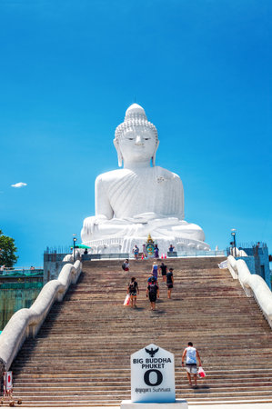 Phuket, Thailand - 28 February 2018: White marble statue of Phuket Big Buddha and people on staircase by blue sky in Thailandのeditorial素材