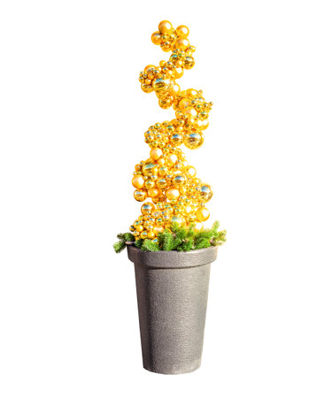 Christmas tree made entirely of golden baubles in pot isolated on white background. Xmas decoration of shiny gold balls in vase. Alternative covered potted ornament of bright glass toy, modern decorの写真素材