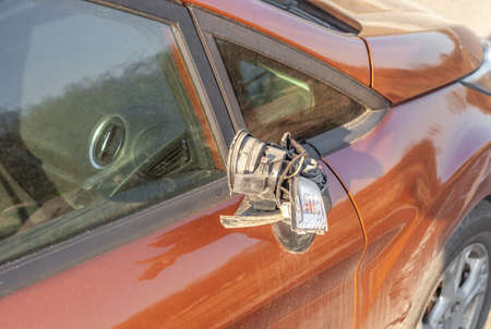 Broken side mirror on dirty car. Damaged right door mirror close upの写真素材