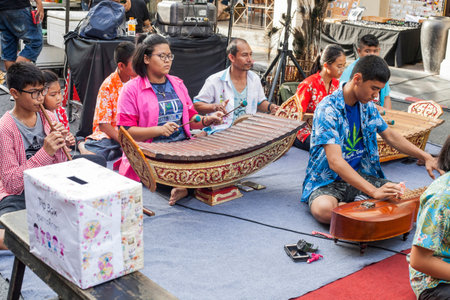 Phuket, Thailand - February 25, 2018: musical group playing different instruments on city streetのeditorial素材