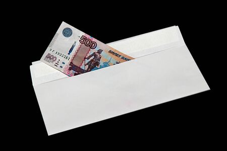 Money in envelope on black backgroundの写真素材